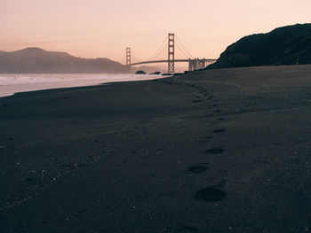 View of suspension bridge at sunset