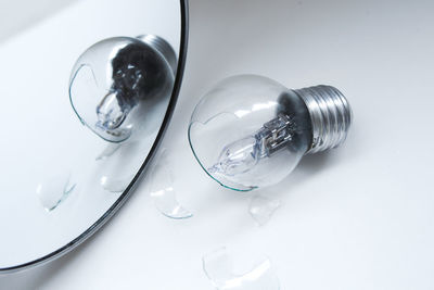 High angle view of light bulb on table