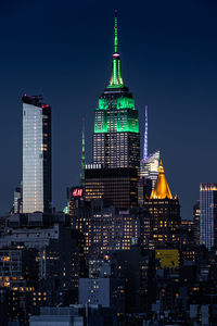 Illuminated buildings in city at night