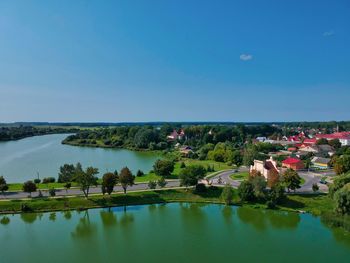 Scenic view of lake against clear blue sky