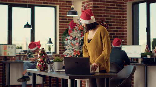 Young woman using laptop at home