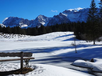 Scenic view of snow covered mountains against sky