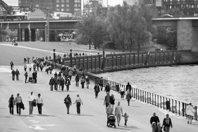 High angle view of people walking on street by rhine river