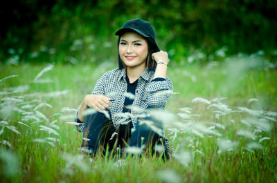 Young woman smiling on field