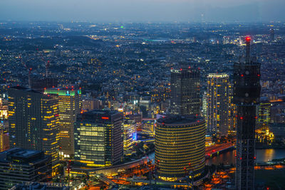 High angle view of illuminated buildings in city against sky