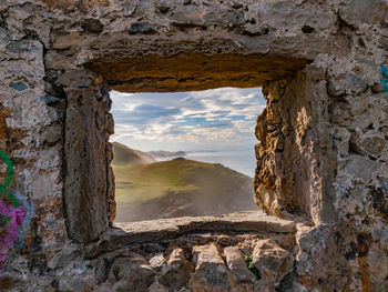 Close-up of window on stone wall 