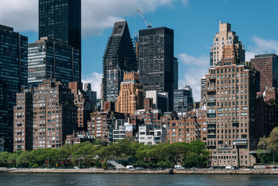 Buildings in city against sky