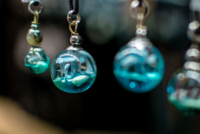 Close-up of christmas decoration hanging on glass