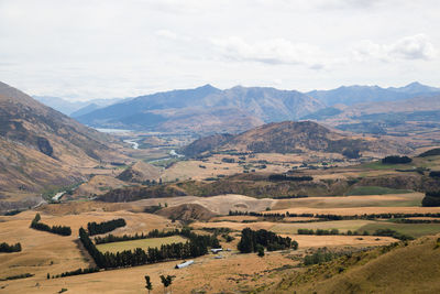 Scenic view of landscape and mountains against sky