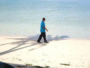 Full length of woman standing on shore