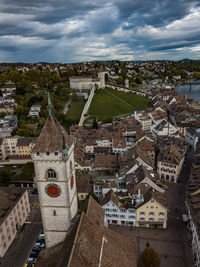 High angle view of town against cloudy sky