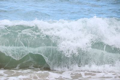 Sea waves splashing on shore