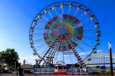 Ferris wheel against blue sky