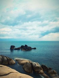 Scenic view of sea against cloudy sky
