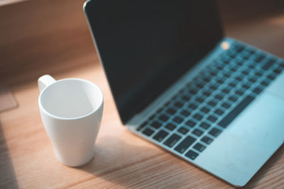 High angle view of coffee cup on table