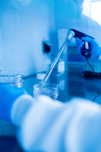 Cropped hand of scientist holding dental clinic