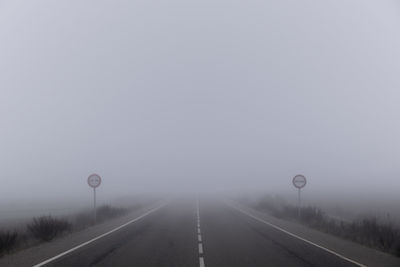 Empty road during foggy weather