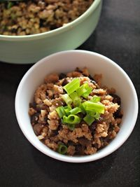 High angle view of braised pork rice served in bowl on table