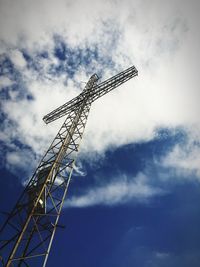 Low angle view of communications tower against sky