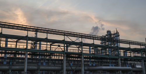 Low angle view of bridge against sky during sunset