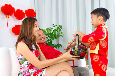 Happy family celebrating chinese new year at home