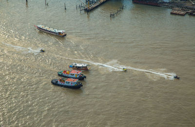 High angle view of people on boat sailing in river