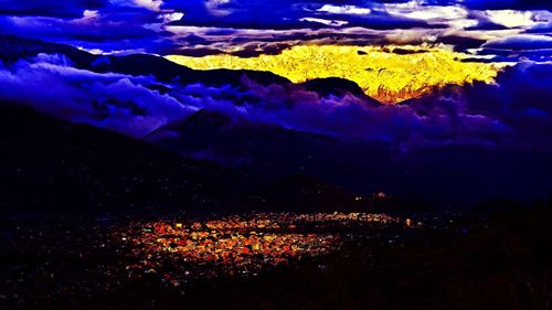 Scenic view of landscape against sky at night
