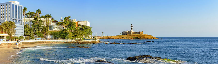 Panoramic image of the barra lighthouse, beach and buildings in the city of salvador in bahia