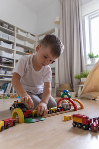 Boy playing with toys at home