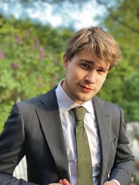 Portrait of businessman standing outdoors