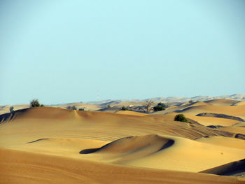 Scenic view of desert against clear sky