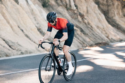 Man riding bicycle on mountain