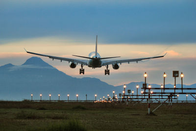 Low angle view of airplane flying against clear sky