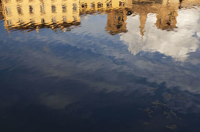 Reflection of sky on puddle