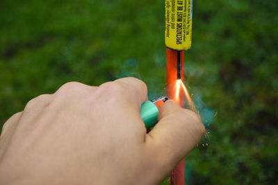 Close-up of hand holding finger