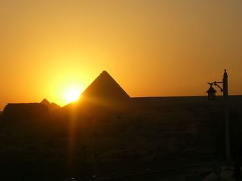 Silhouette of city during sunset