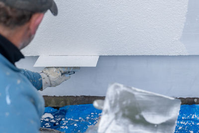 Midsection of man with dog