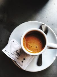 High angle view of coffee cup on table