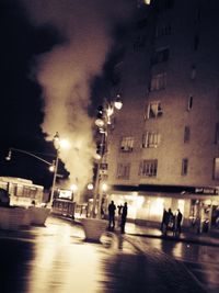 People walking on street at night