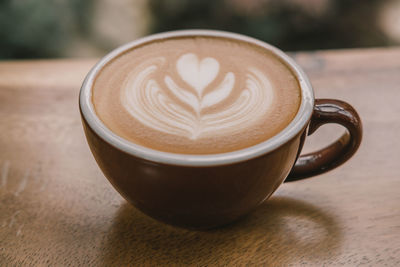 Close-up of cappuccino on table