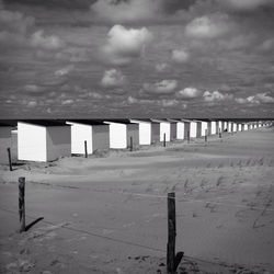 View of beach against cloudy sky