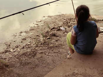 Girl fishing in lake