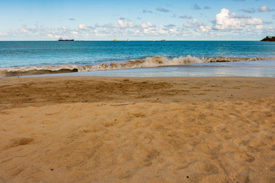 Scenic view of beach against sky