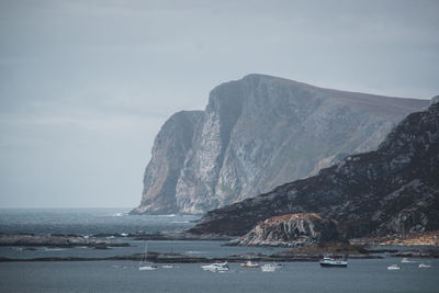 Scenic view of sea and rocks against sky