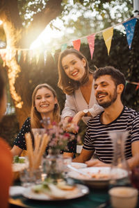 Happy young couple with food on table