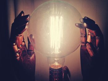 Close-up of illuminated light bulb
