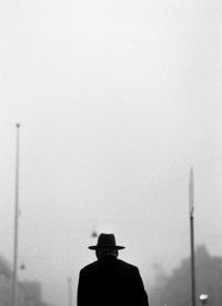 Rear view of man against sky