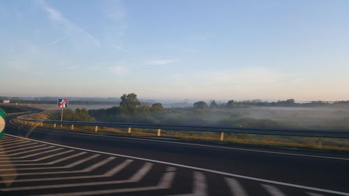 View of road against cloudy sky