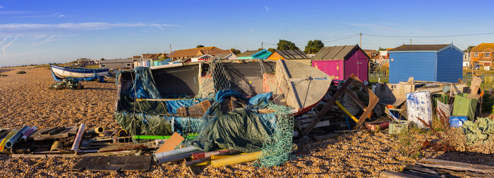 Fishing net on beach against sky