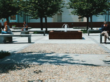 People sitting on bench in park